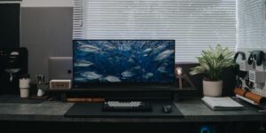 A modern, organized home office workspace bathed in natural light.