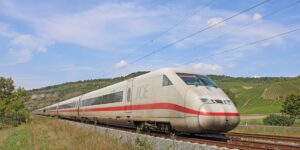 A scenic view comparing high-speed rail and air travel for sustainable trip planning.