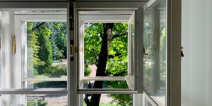 A peaceful workspace looking out into a garden, symbolizing the calm of a career break.