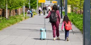 A family traveling together in a modern, accessible airport terminal.