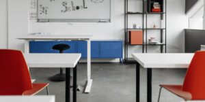 A modern desk setup representing a balance between traditional learning and technology.