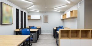 A bright, modern modular home office designed for two people.