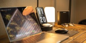 A modern home office setup representing the balance of professional freelance work and parenting.