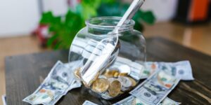 A glass jar filled with paper slips on a table representing an emotional vocabulary tool.