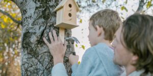 Parent and child working on a DIY woodworking project together