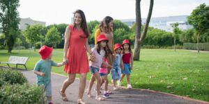 A happy multi-generational family walking together on a scenic path.