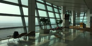 A quiet and comfortable airport lounge with tarmac views.