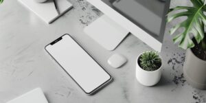 A clean desk setup with a smartphone, symbolizing digital organization for modern parents.