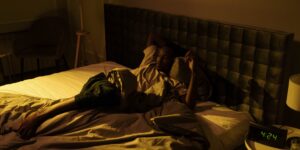 A serene, dimly lit bedroom designed for optimal sleep hygiene.