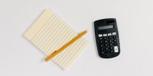 A clean, organized workspace with financial planning tools, representing a subscription audit.