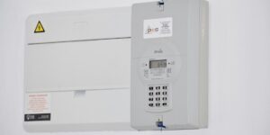 A modern smart meter device installed on a home wall representing the 2026 energy grid update.
