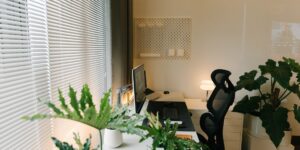 A modern, organized home office workspace bathed in natural light.