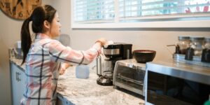 A clean, modern kitchen scene with a chore chart, representing organized family life.