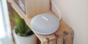 A sleek, modern smart home hub on a shelf representing private, local home automation.