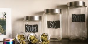 A glass jar labeled for emotional vocabulary sitting on a wooden table in a cozy home environment.