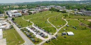 A scenic view of a community micro-festival in a park.