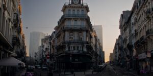 A quiet, atmospheric street scene in a major European capital during the off-season.