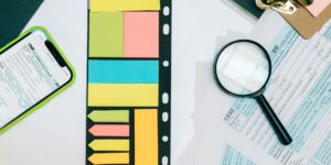 A glass jar filled with colorful paper slips on a kitchen table, representing the Empathy-Jar technique.
