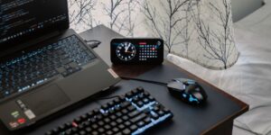 A modern home office setup with a high-end laptop on a wooden desk.