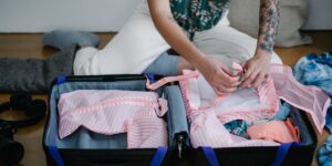 A neatly organized carry-on suitcase with packing cubes.