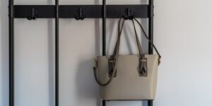 A clean, organized family entryway showing various bags and items in a modern home.