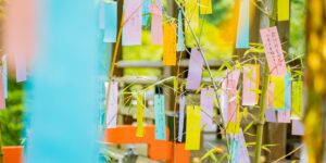 A glass jar filled with colorful paper slips representing emotions sitting in a sunlit room.