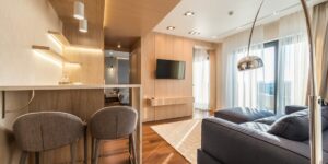 A warm and modern living room illuminated by smart lighting.