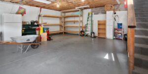 A well-organized garage filled with shared community tools and seasonal equipment.