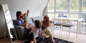 A bright, modern multi-generational living room that blends comfort with smart technology.