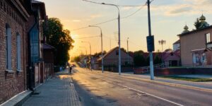 A quiet, empty European street at golden hour representing off-peak travel.