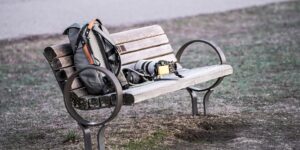 Minimalist gear setup for busy parents on a wooden bench.