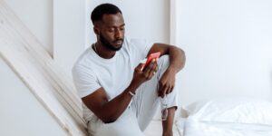 A person setting aside their smartphone to enjoy personal time, representing the right to disconnect.