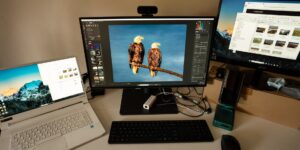 A clean desk setup with devices showing organized digital photos.