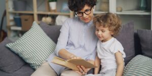 A calm, neutral-toned illustration of a parent and child sharing a quiet moment.