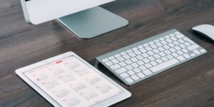 A clean, modern digital family calendar on a tablet screen, symbolizing organization and ease.