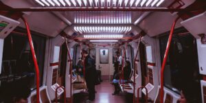 A happy family sitting in a modern train carriage enjoying their journey.