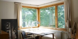 A peaceful home office workspace bathed in natural light, representing a calm environment for a micro-sabbatical.