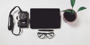 A clean, organized workspace with technology for managing digital photos.