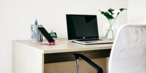 A clean desk setup with a smartphone, representing digital organization.