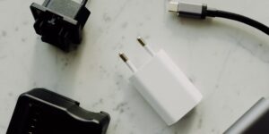 A minimalist workspace featuring a universal USB-C charging setup for multiple devices.