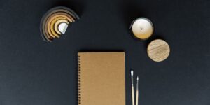 A peaceful journaling setup with natural elements on a wooden table.