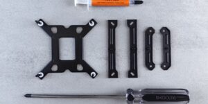 A professional workbench setup showing the tools and parts needed for hardware repair.