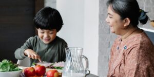A family planning their multi-generational trip together at a dining table.