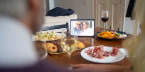 A tablet set up for a video call in a cozy home environment.