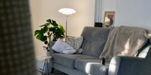 A cozy, minimalist reading corner in a small modern apartment.