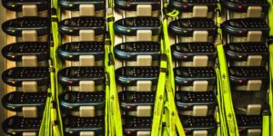 An organized collection of old electronic devices and cables ready for recycling.