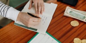 A clean, organized workspace with a budget notebook representing financial planning.