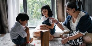 A family enjoying a screen-free weekend with board games and books.