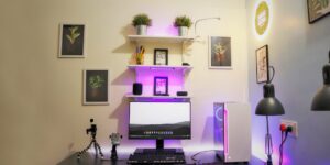 A modern home office setup featuring a clean desk and a minimalist mesh Wi-Fi node.