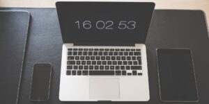 A clean workspace with various electronic devices.